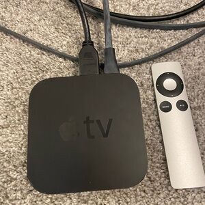 Apple TV with cords and remote